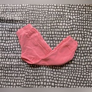 Nike pink sweatpants with the jaw strings on the inside of the pants